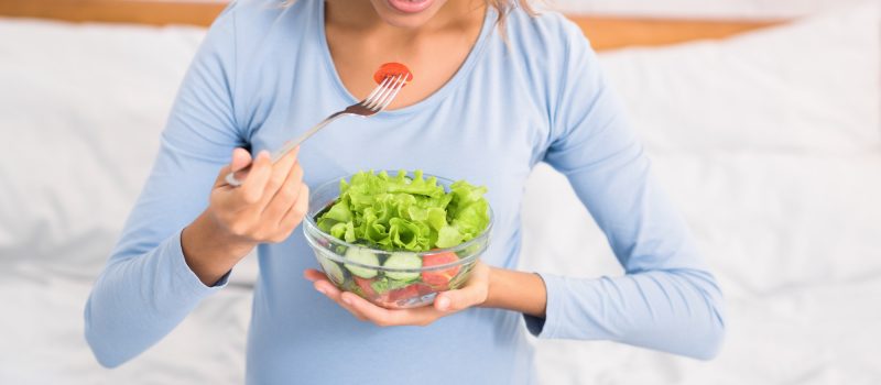 pregnancy-and-nutrition-expectant-woman-eating-fresh-salad.jpg